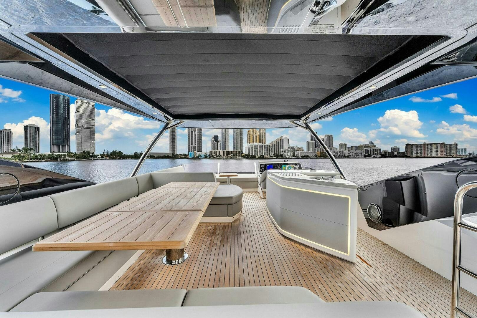 a deck with a bench and a view of a city aboard YOU AND ISLANDS Yacht for Sale