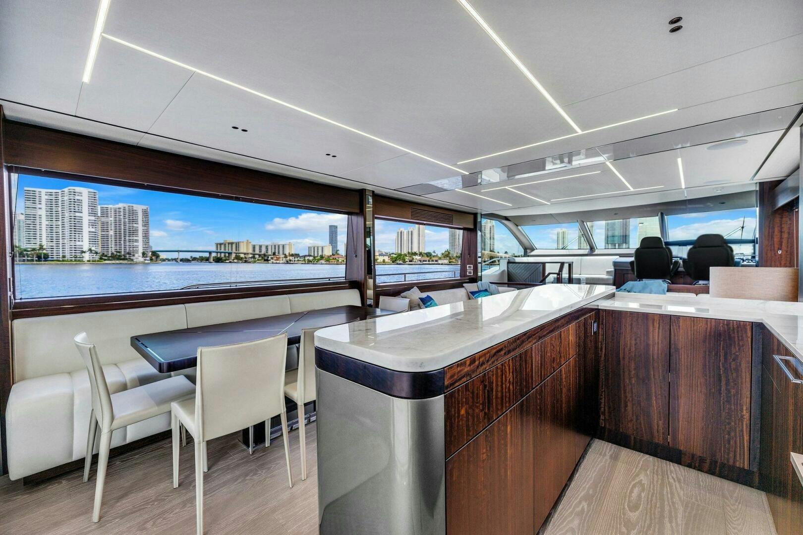 a room with a table and chairs aboard YOU AND ISLANDS Yacht for Sale
