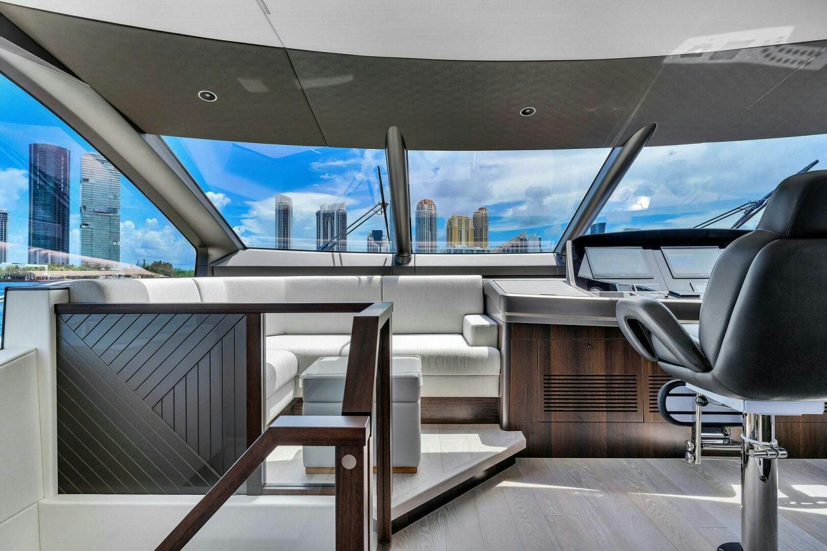 a room with a view of a city from the balcony aboard YOU AND ISLANDS Yacht for Sale