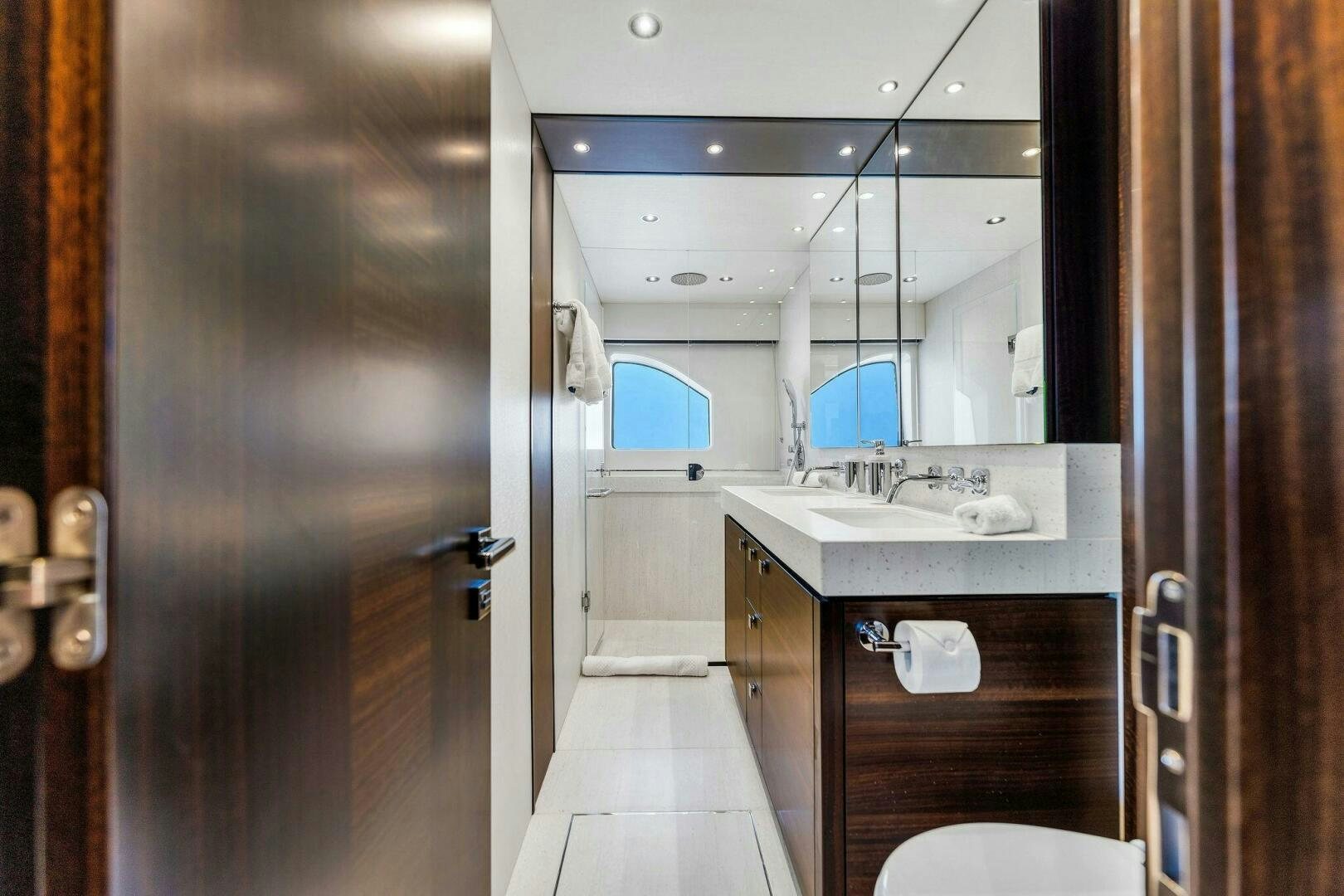 a bathroom with a sink and a mirror aboard YOU AND ISLANDS Yacht for Sale