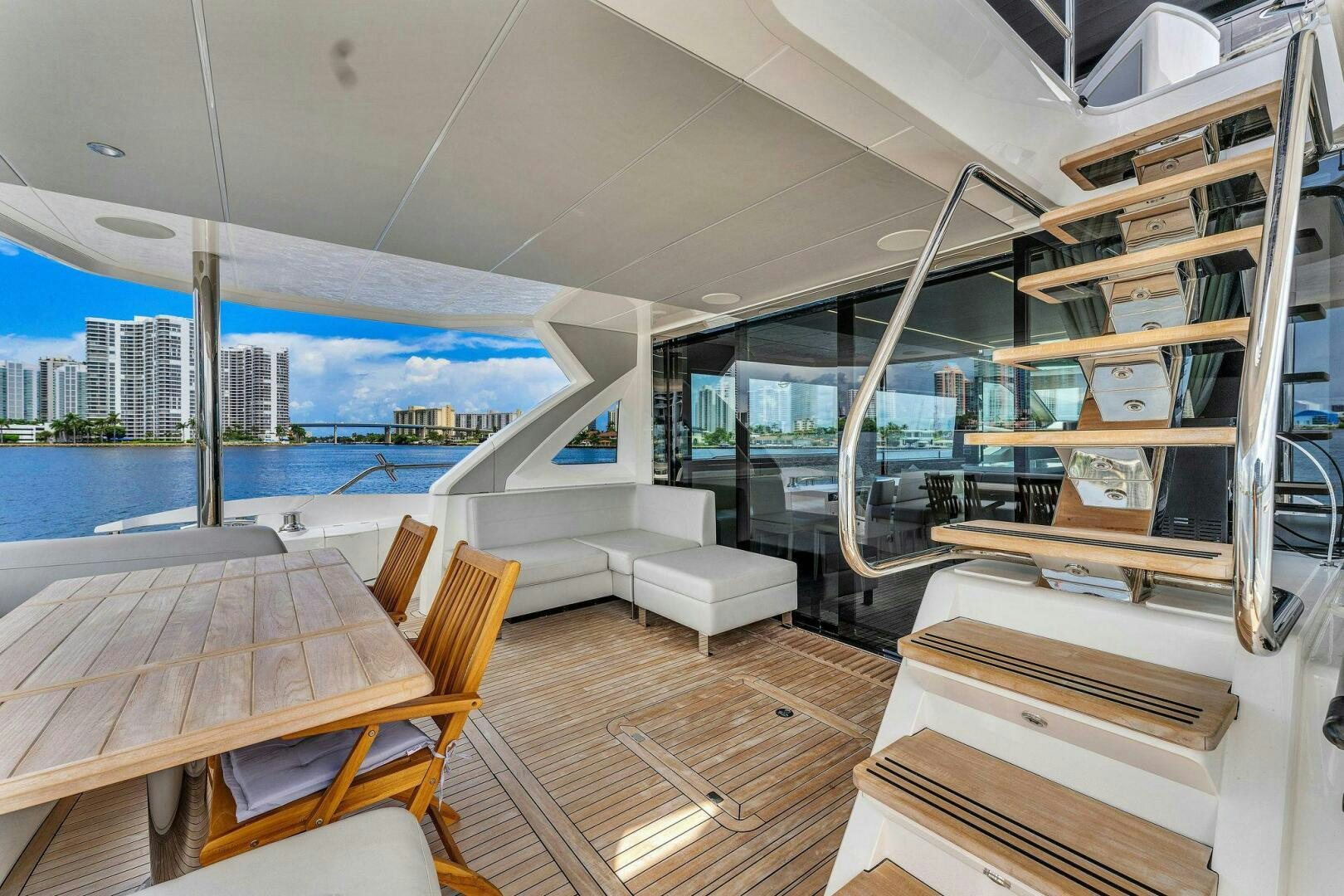 a room with a table and chairs aboard YOU AND ISLANDS Yacht for Sale