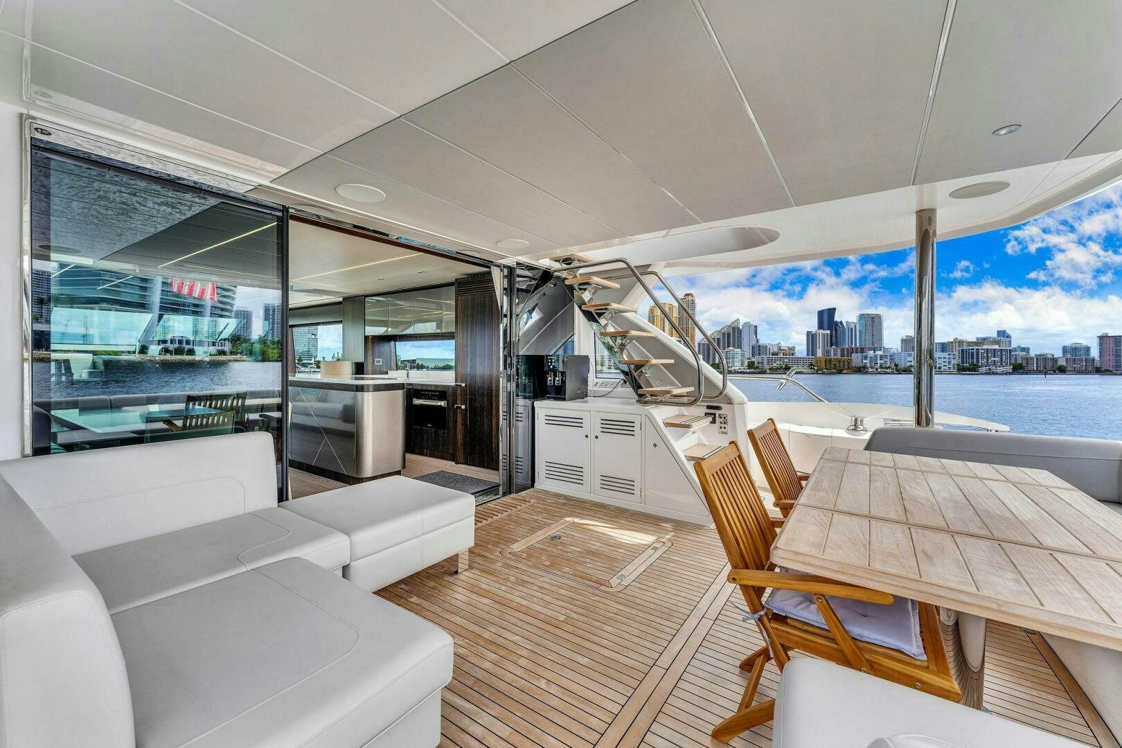 a room with a table and chairs aboard YOU AND ISLANDS Yacht for Sale