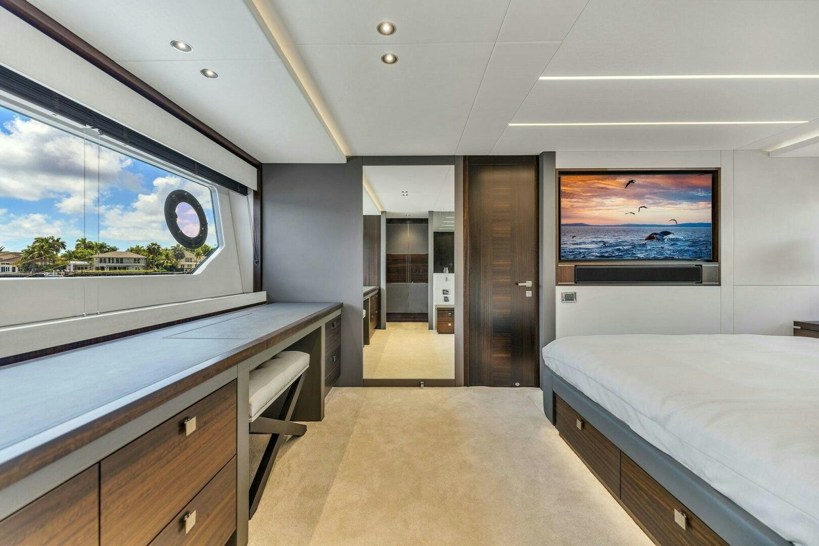 a room with a bed and a desk aboard YOU AND ISLANDS Yacht for Sale