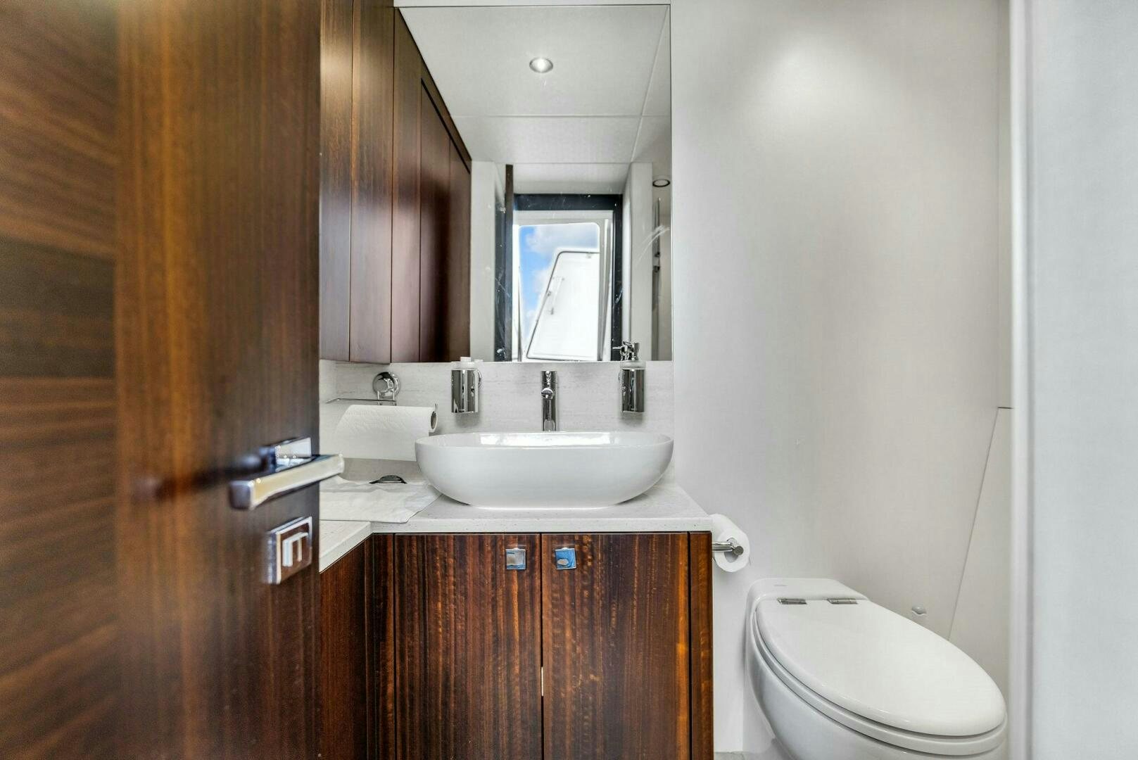 a bathroom with a sink and a toilet aboard YOU AND ISLANDS Yacht for Sale
