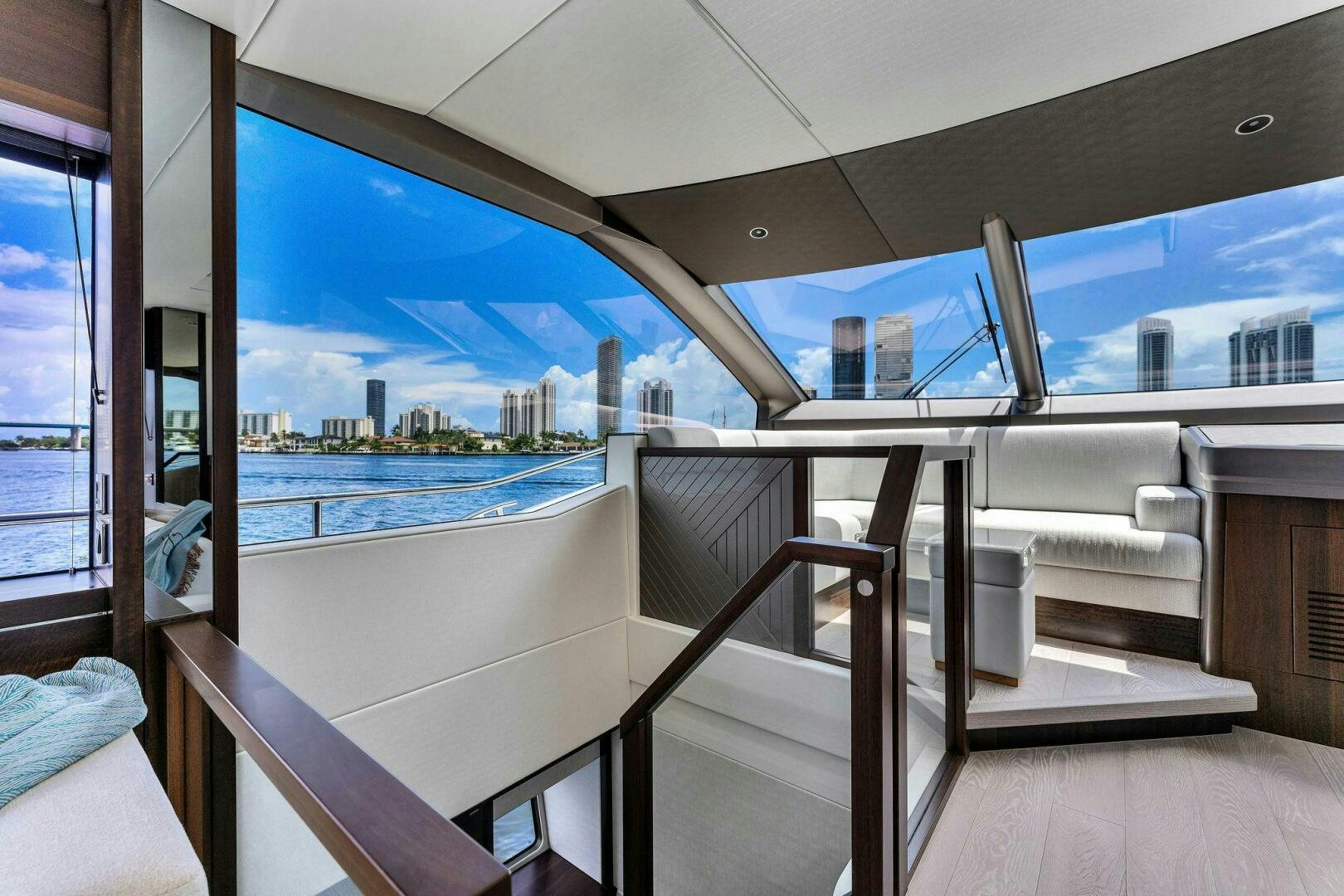 a room with a view of the city and water aboard YOU AND ISLANDS Yacht for Sale