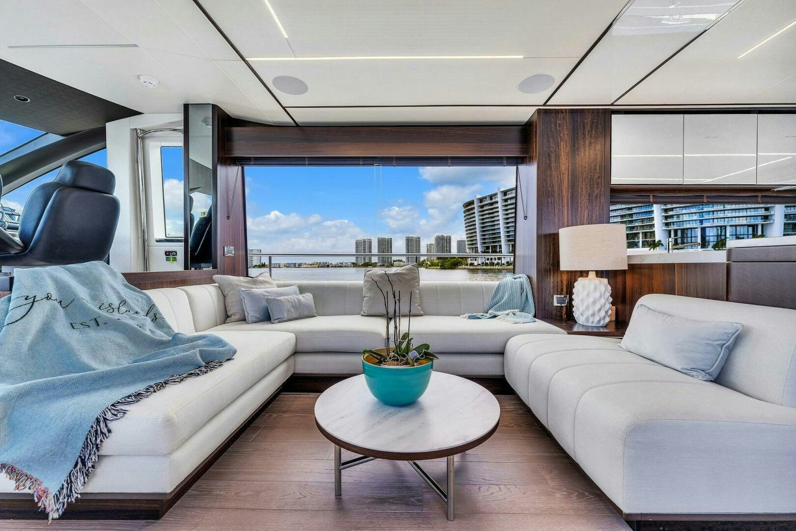 a living room with a large window aboard YOU AND ISLANDS Yacht for Sale