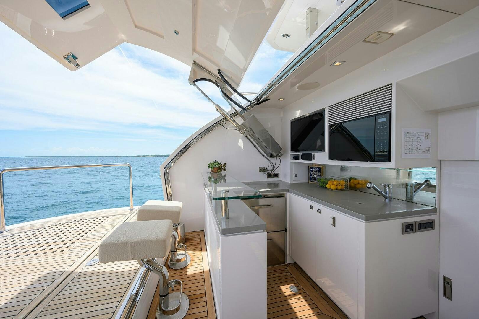 a boat with a sink and a microwave on the deck aboard AQUA LIFE Yacht for Sale