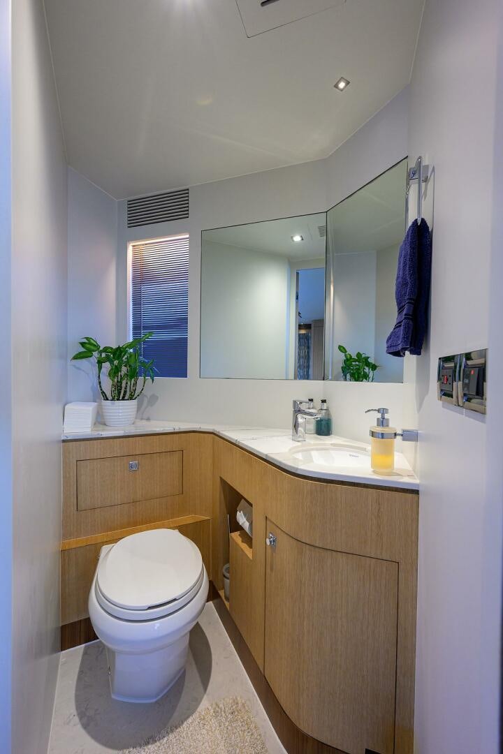 a bathroom with a toilet and a sink aboard AQUA LIFE Yacht for Sale