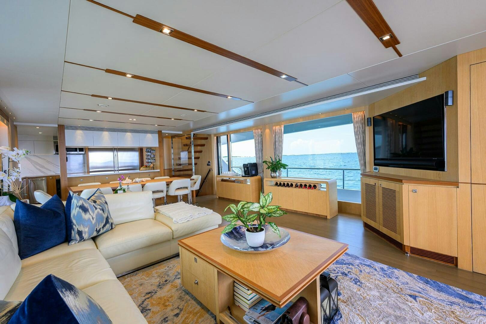a living room with a couch and a television aboard AQUA LIFE Yacht for Sale