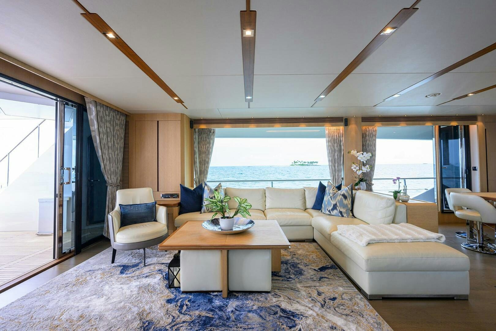 a living room with a large window aboard AQUA LIFE Yacht for Sale
