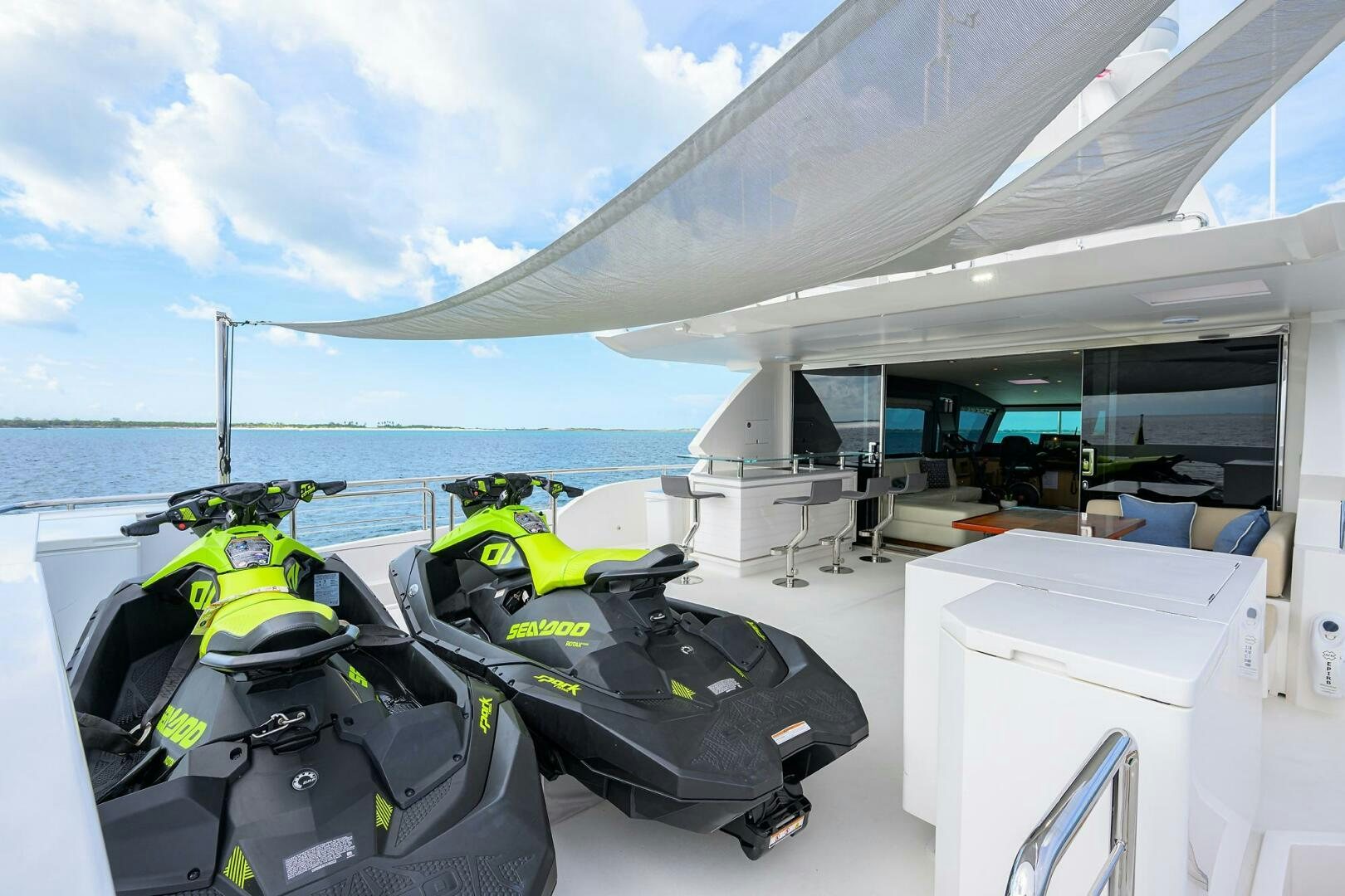 a boat with a green and yellow jet engine on the deck aboard AQUA LIFE Yacht for Sale