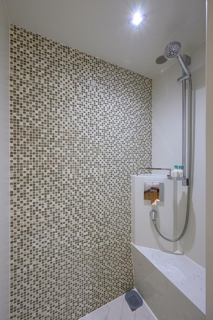 a bathroom with a shower aboard AQUA LIFE Yacht for Sale