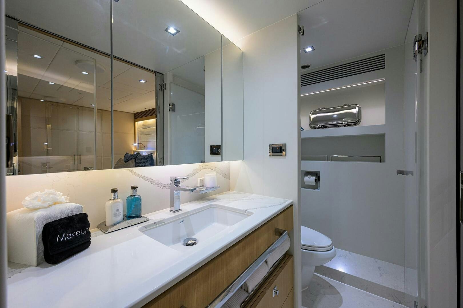 a bathroom with a large mirror aboard AQUA LIFE Yacht for Sale