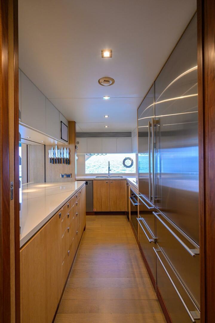 a long hallway with glass doors aboard AQUA LIFE Yacht for Sale