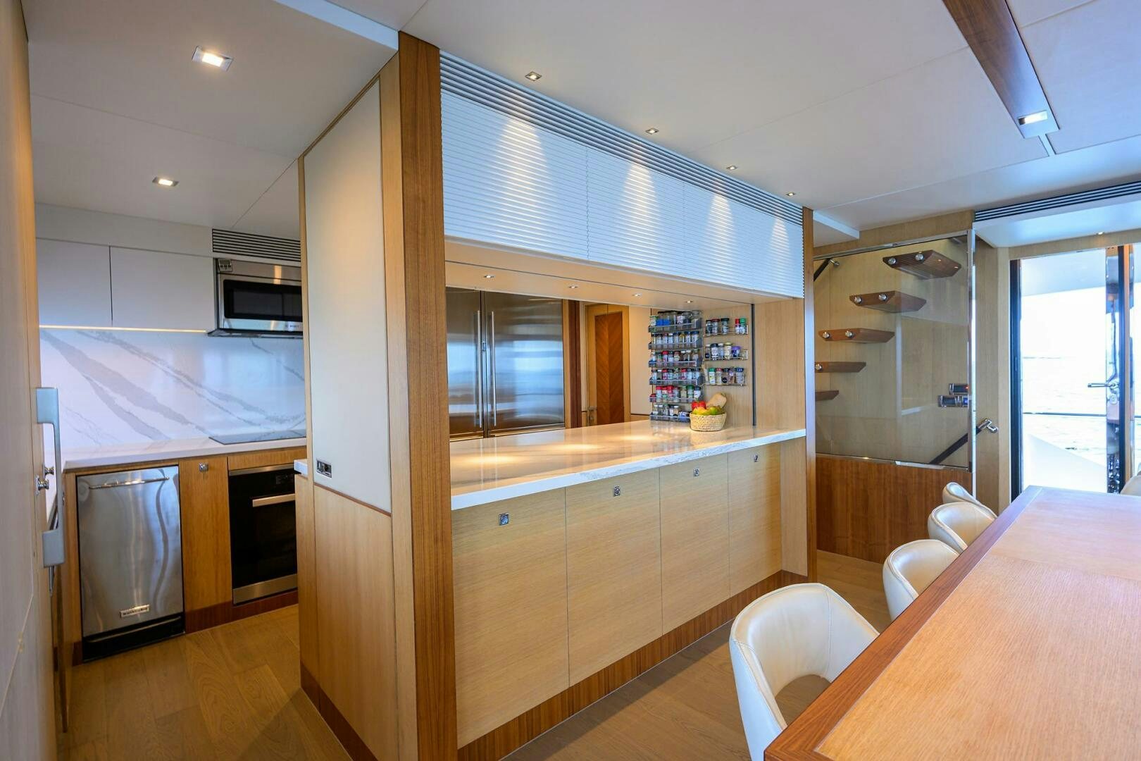 a kitchen with a large glass window aboard AQUA LIFE Yacht for Sale