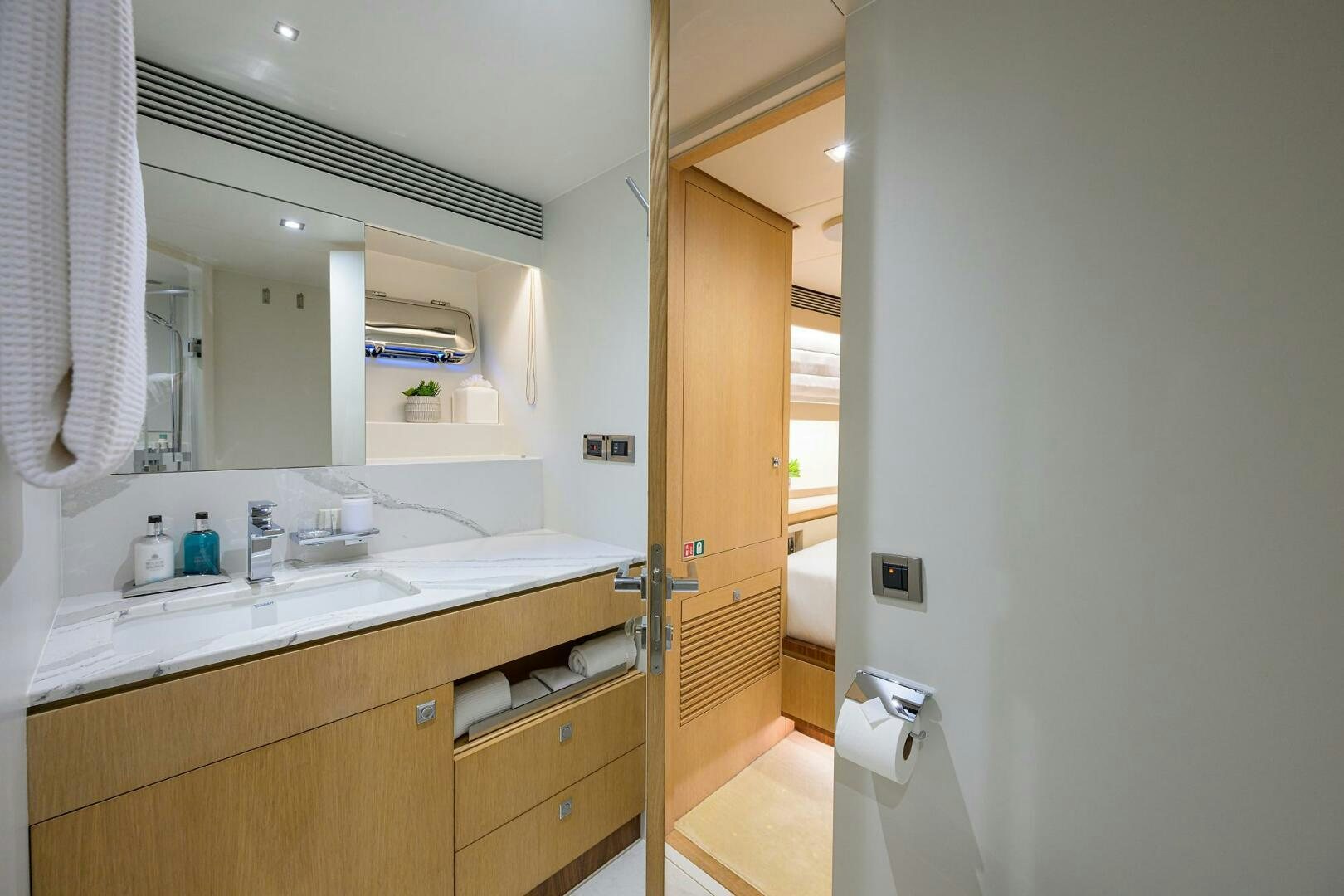a bathroom with a sink and a mirror aboard AQUA LIFE Yacht for Sale
