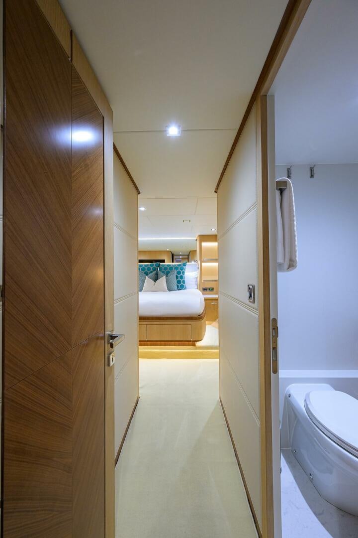 a bathroom with a white bed aboard AQUA LIFE Yacht for Sale
