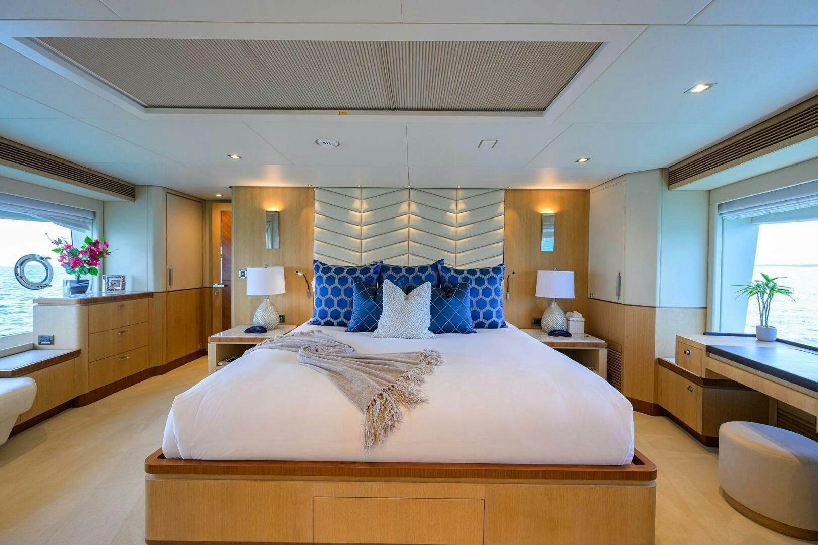 a bedroom with a bed and a desk aboard AQUA LIFE Yacht for Sale