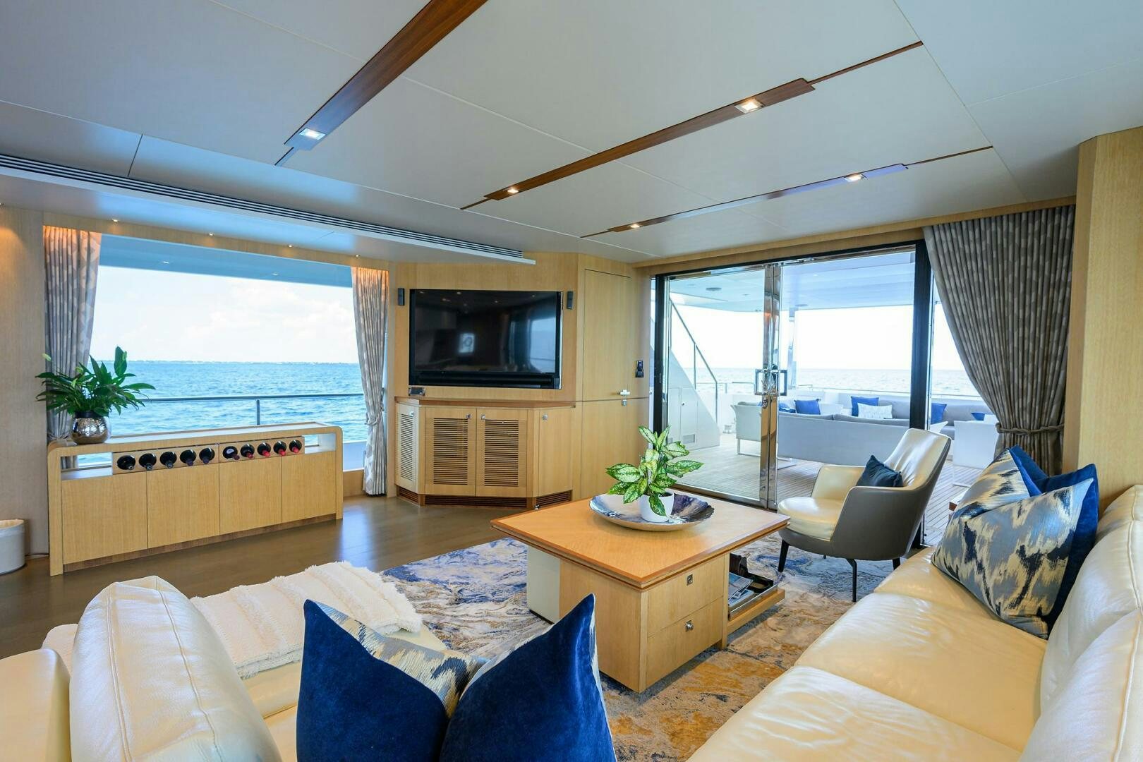 a living room with a large window aboard AQUA LIFE Yacht for Sale