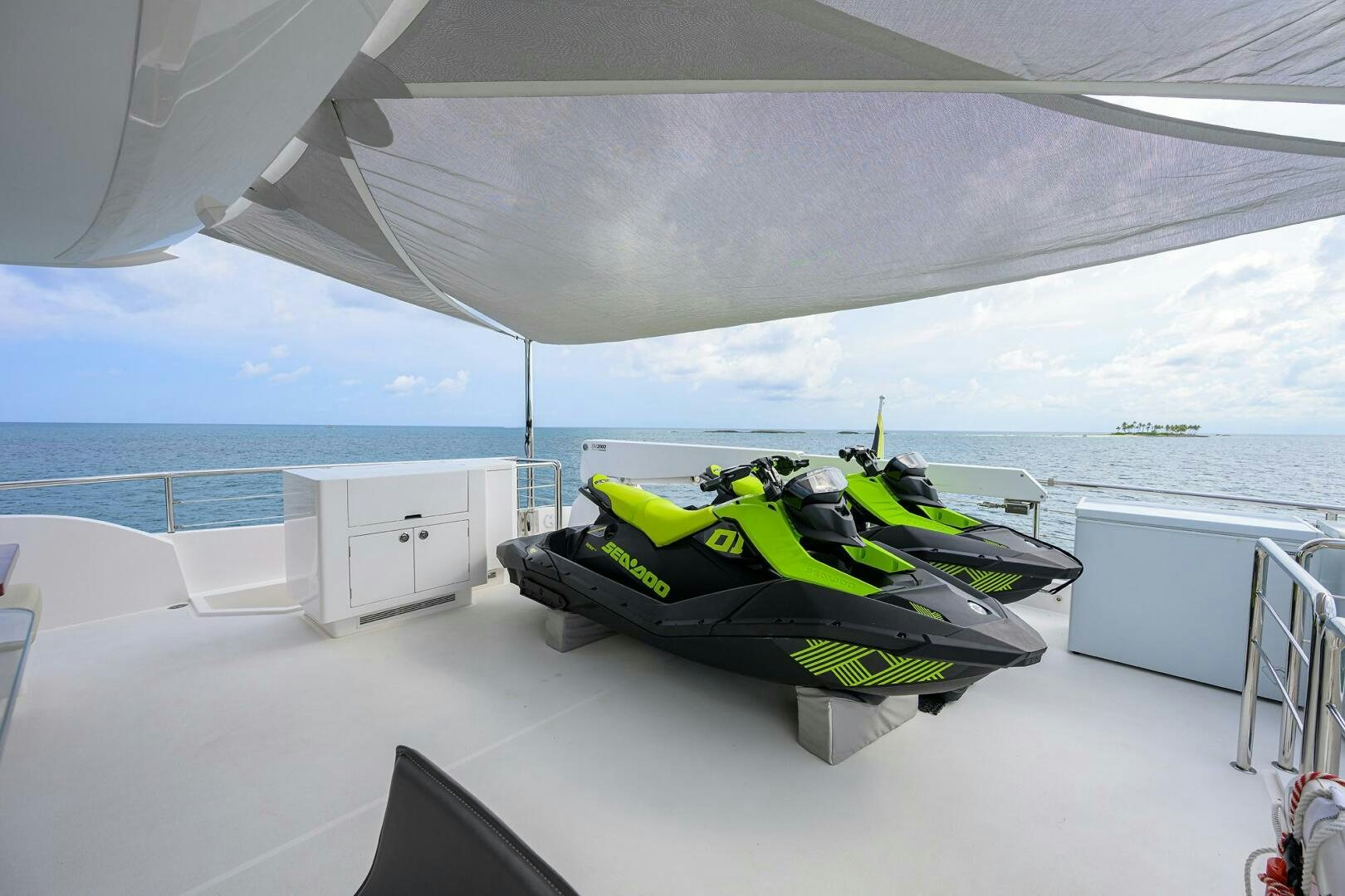 a large white tent with a green and black mat on it aboard AQUA LIFE Yacht for Sale