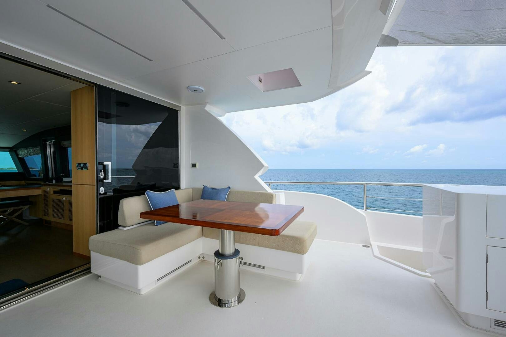 a room with a table and a window aboard AQUA LIFE Yacht for Sale