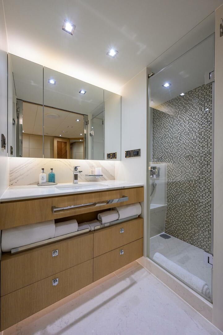 a bathroom with a large mirror aboard AQUA LIFE Yacht for Sale