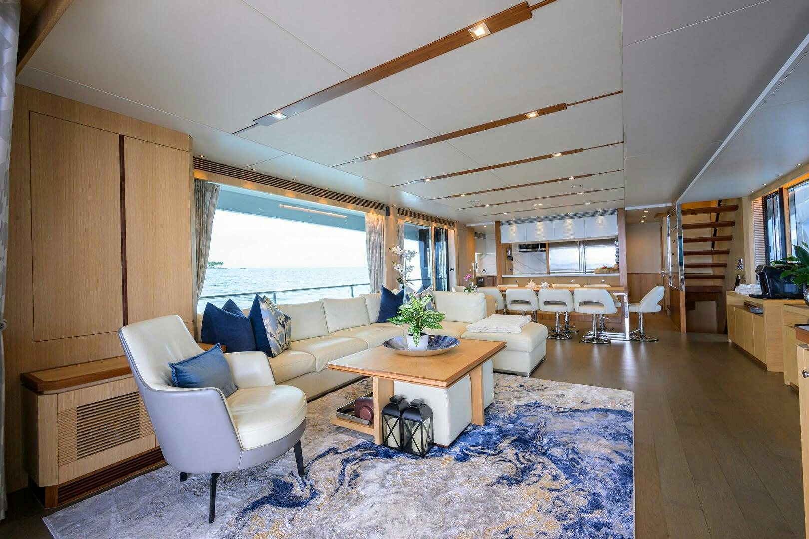 a living room with a rug and a rug aboard AQUA LIFE Yacht for Sale