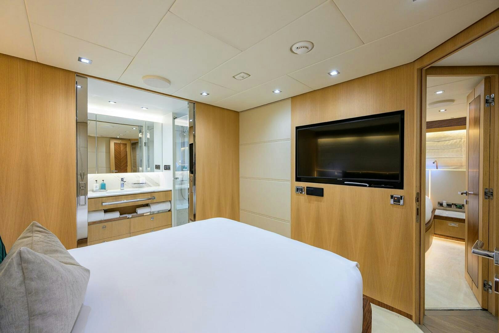 a hotel room with a bed and tv aboard AQUA LIFE Yacht for Sale