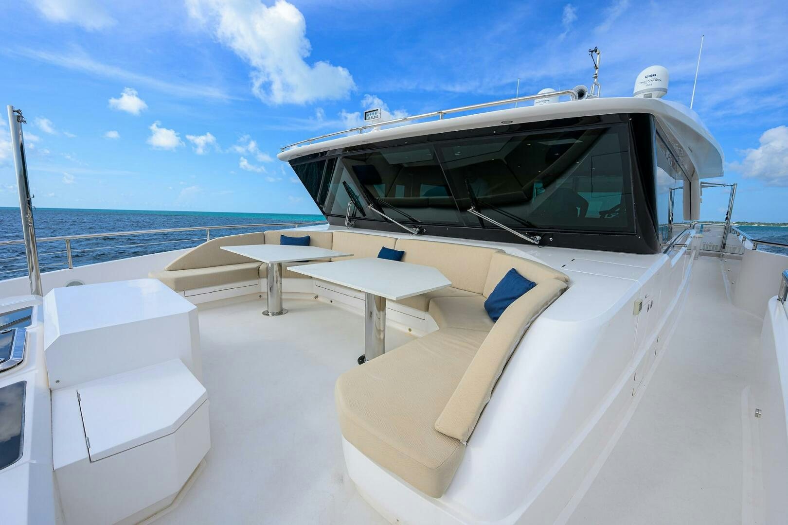 a white boat on a beach aboard AQUA LIFE Yacht for Sale