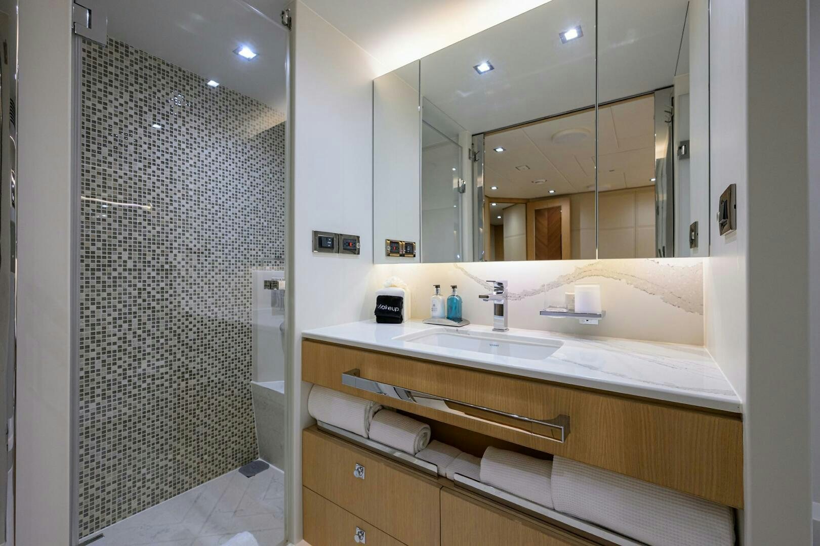 a bathroom with a large mirror aboard AQUA LIFE Yacht for Sale