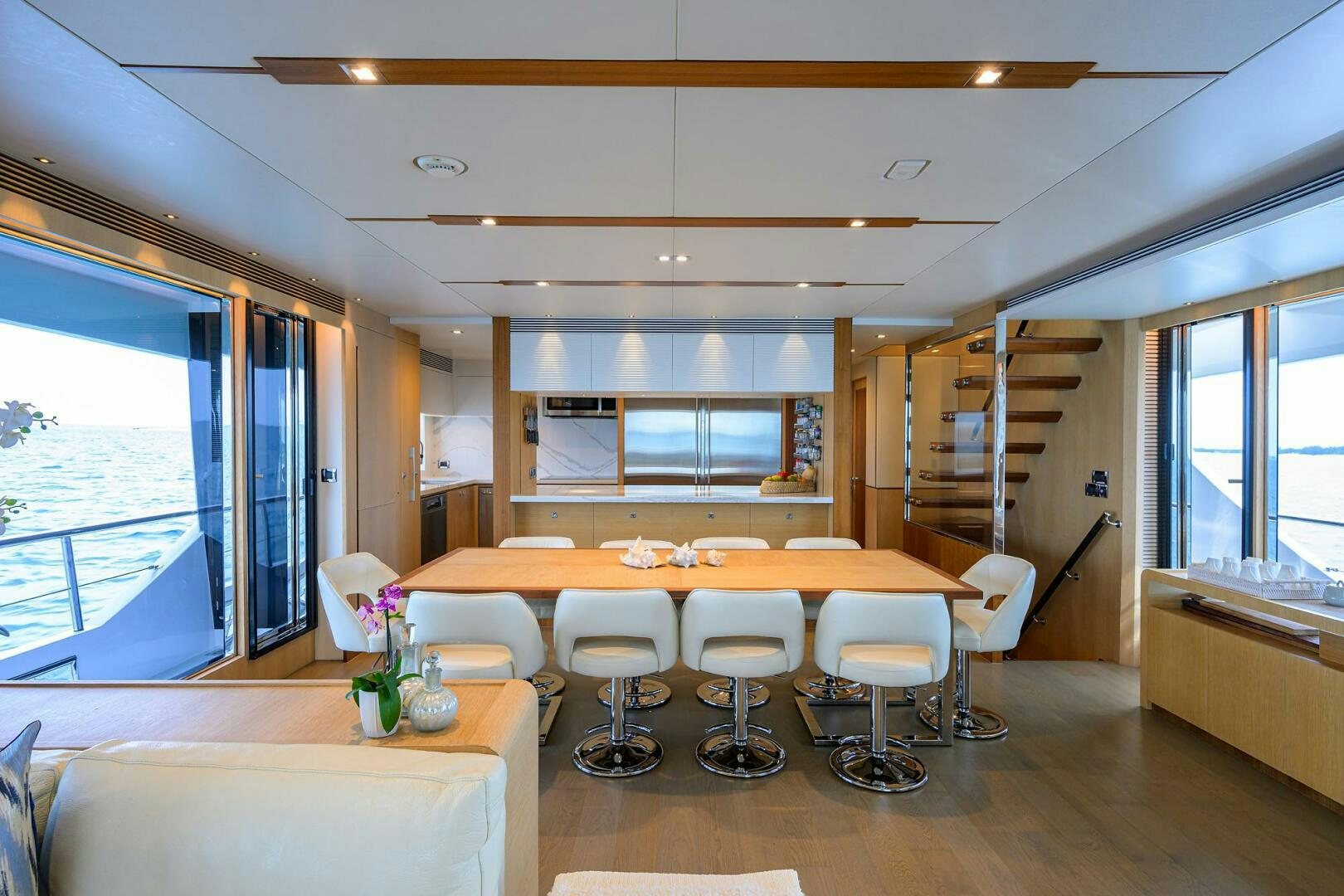 a room with a table chairs and a window aboard AQUA LIFE Yacht for Sale