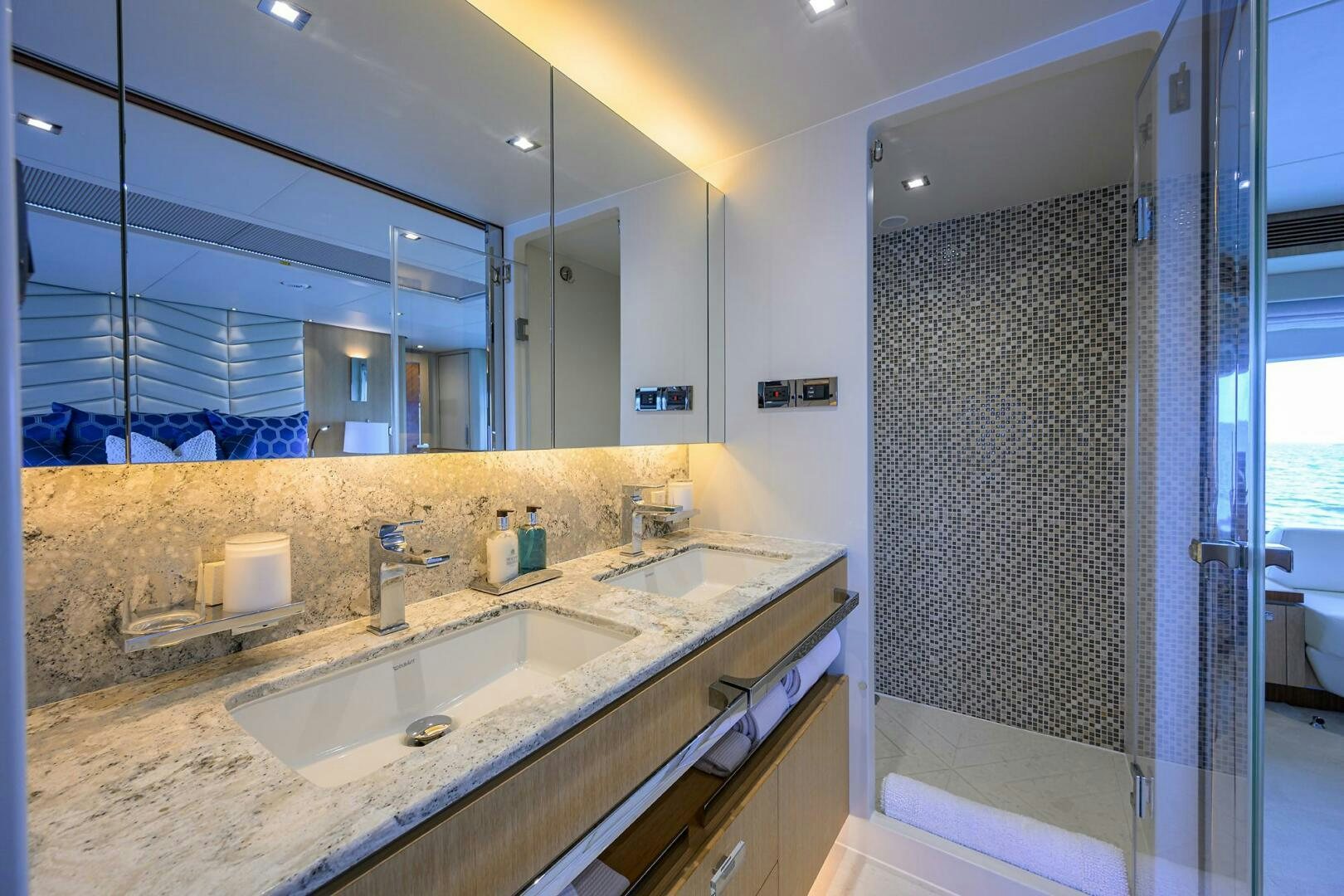 a bathroom with a large mirror aboard AQUA LIFE Yacht for Sale