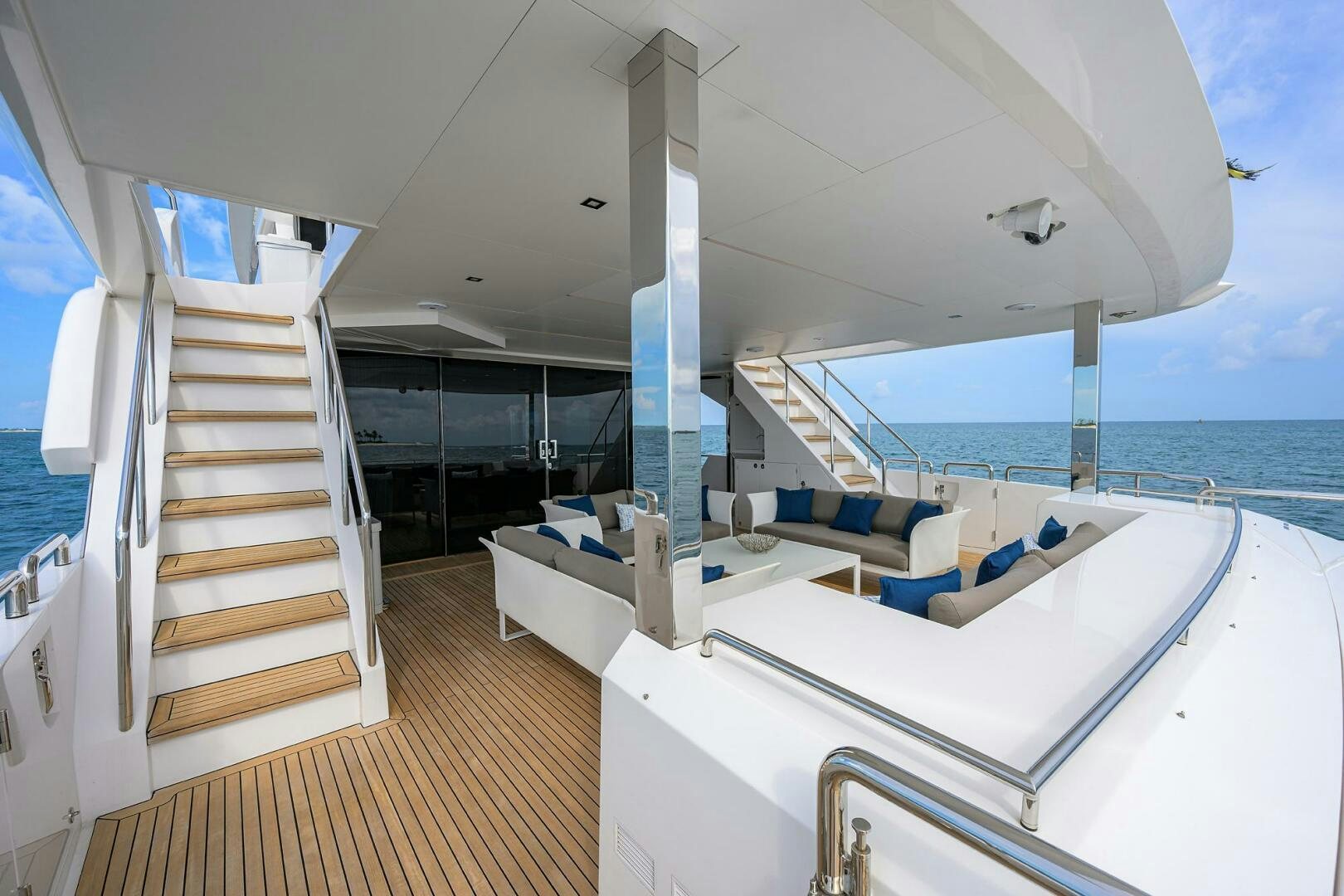 a room with a balcony and a view of the ocean aboard AQUA LIFE Yacht for Sale