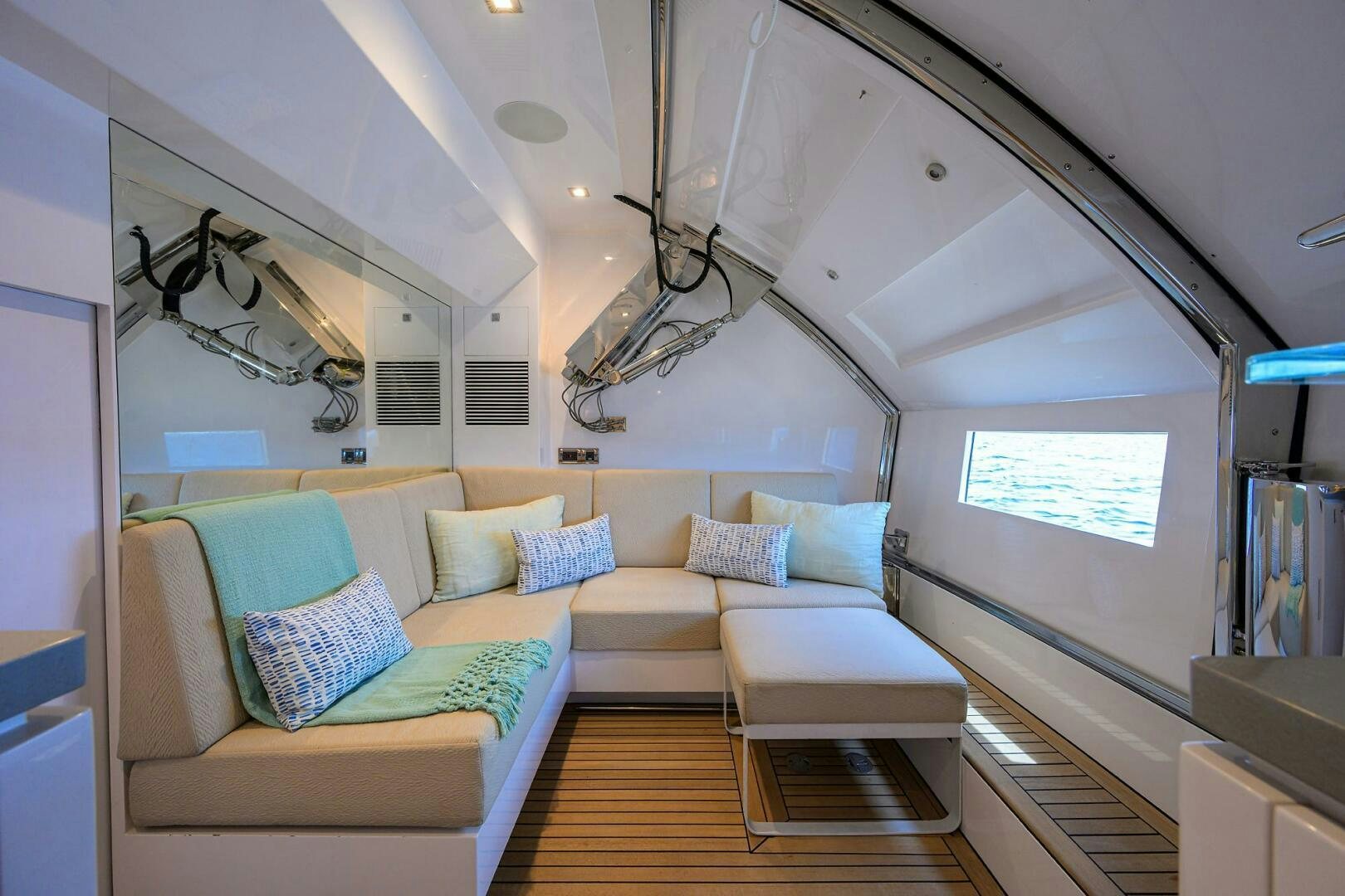 a living room with a couch and a television aboard AQUA LIFE Yacht for Sale