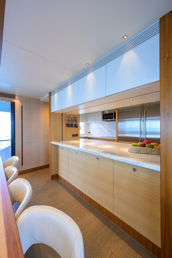 a kitchen with a large island aboard AQUA LIFE Yacht for Sale