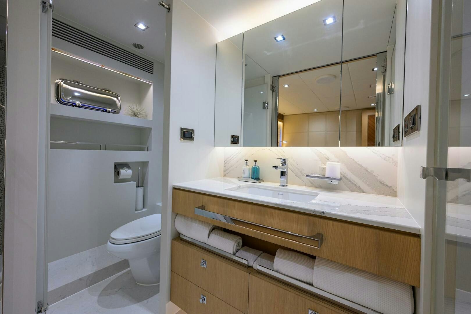 a bathroom with a large mirror aboard AQUA LIFE Yacht for Sale