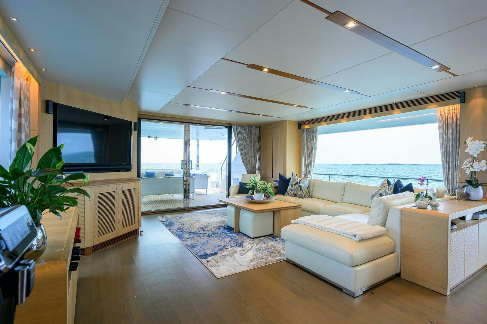 a living room with a large window aboard AQUA LIFE Yacht for Sale
