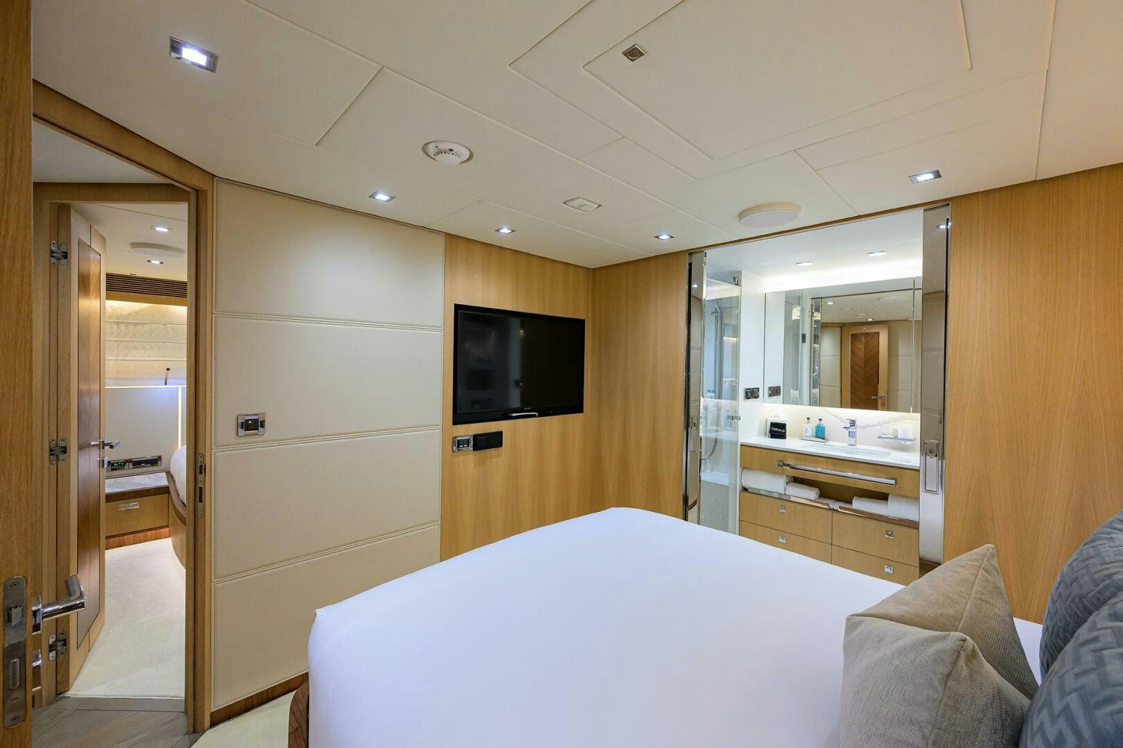 a hotel room with a bed and tv aboard AQUA LIFE Yacht for Sale