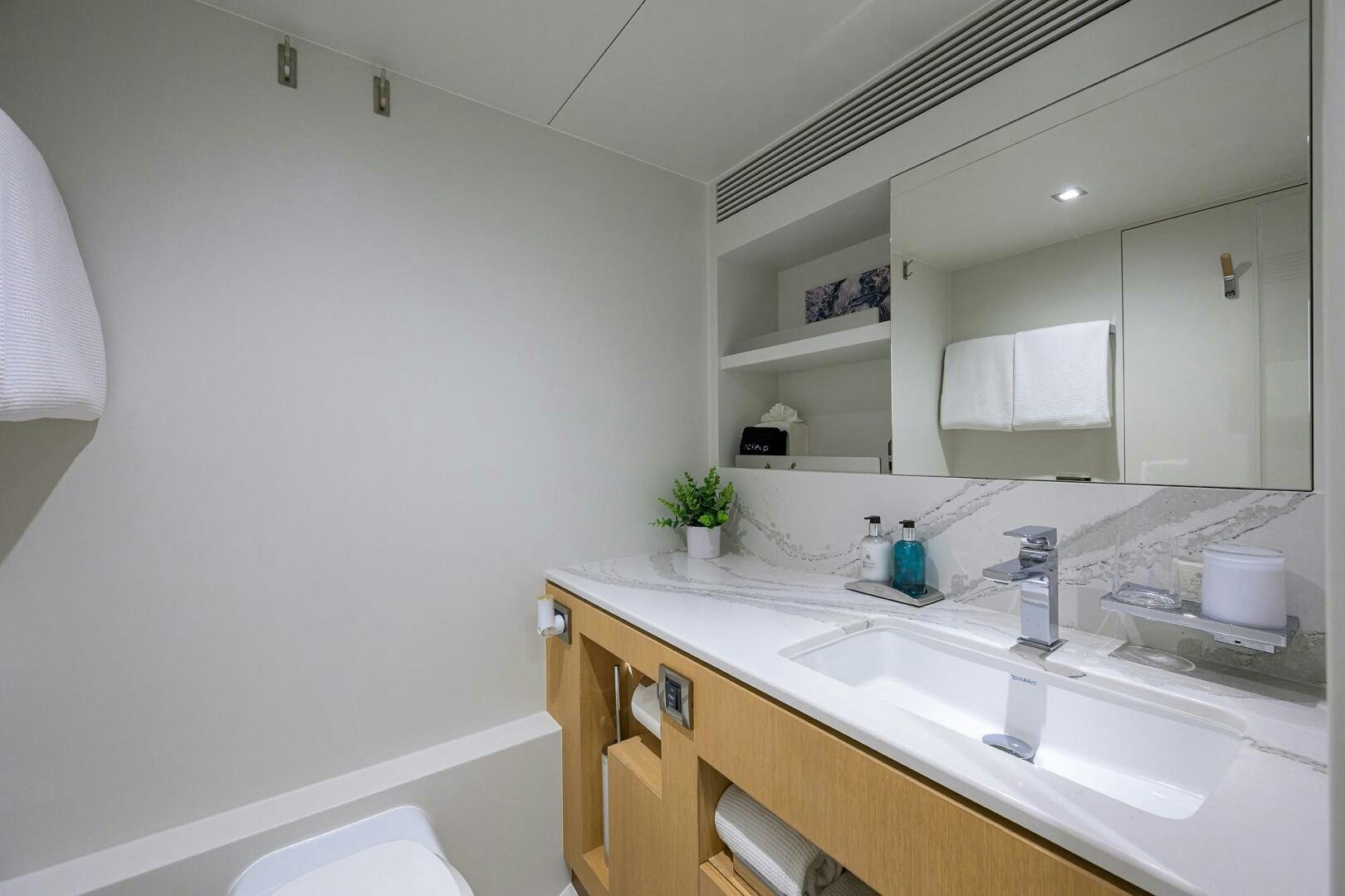 a bathroom with a large mirror aboard AQUA LIFE Yacht for Sale