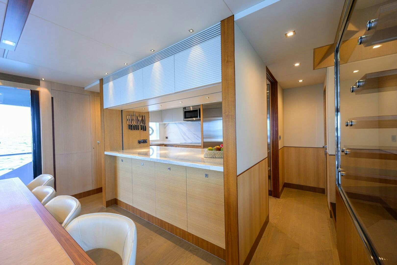 a kitchen with a glass door aboard AQUA LIFE Yacht for Sale