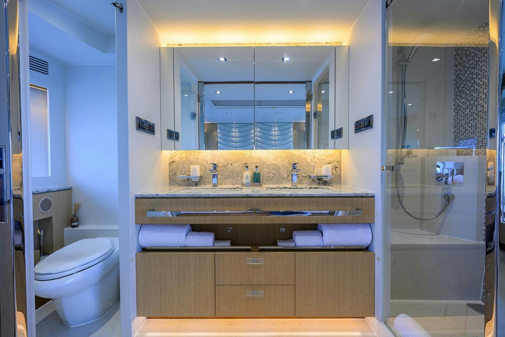 a bathroom with a large mirror aboard AQUA LIFE Yacht for Sale