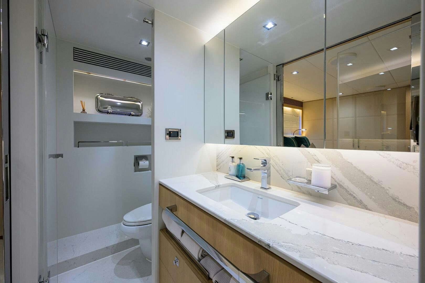 a bathroom with a large mirror aboard AQUA LIFE Yacht for Sale