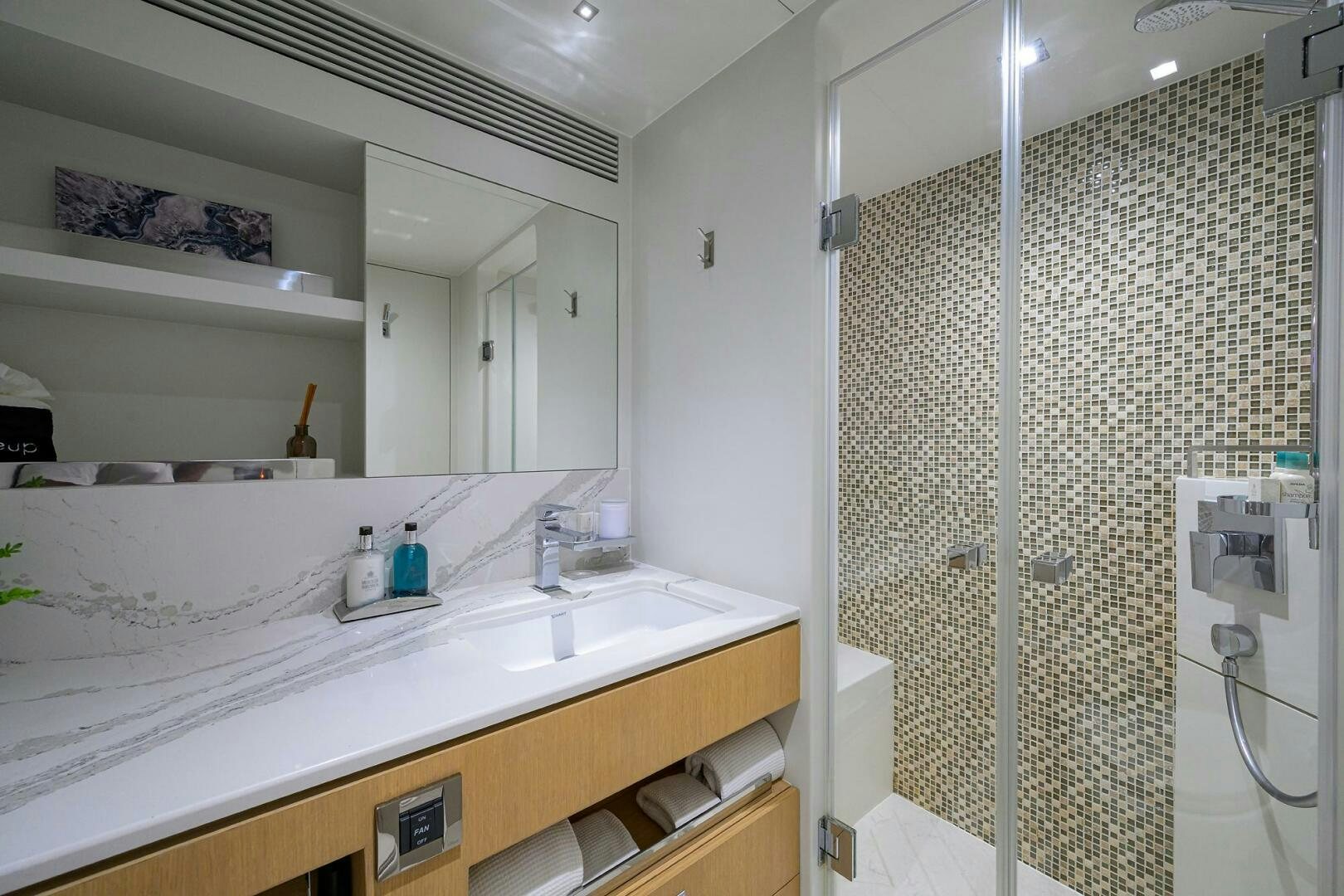 a bathroom with a shower unit and sink aboard AQUA LIFE Yacht for Sale