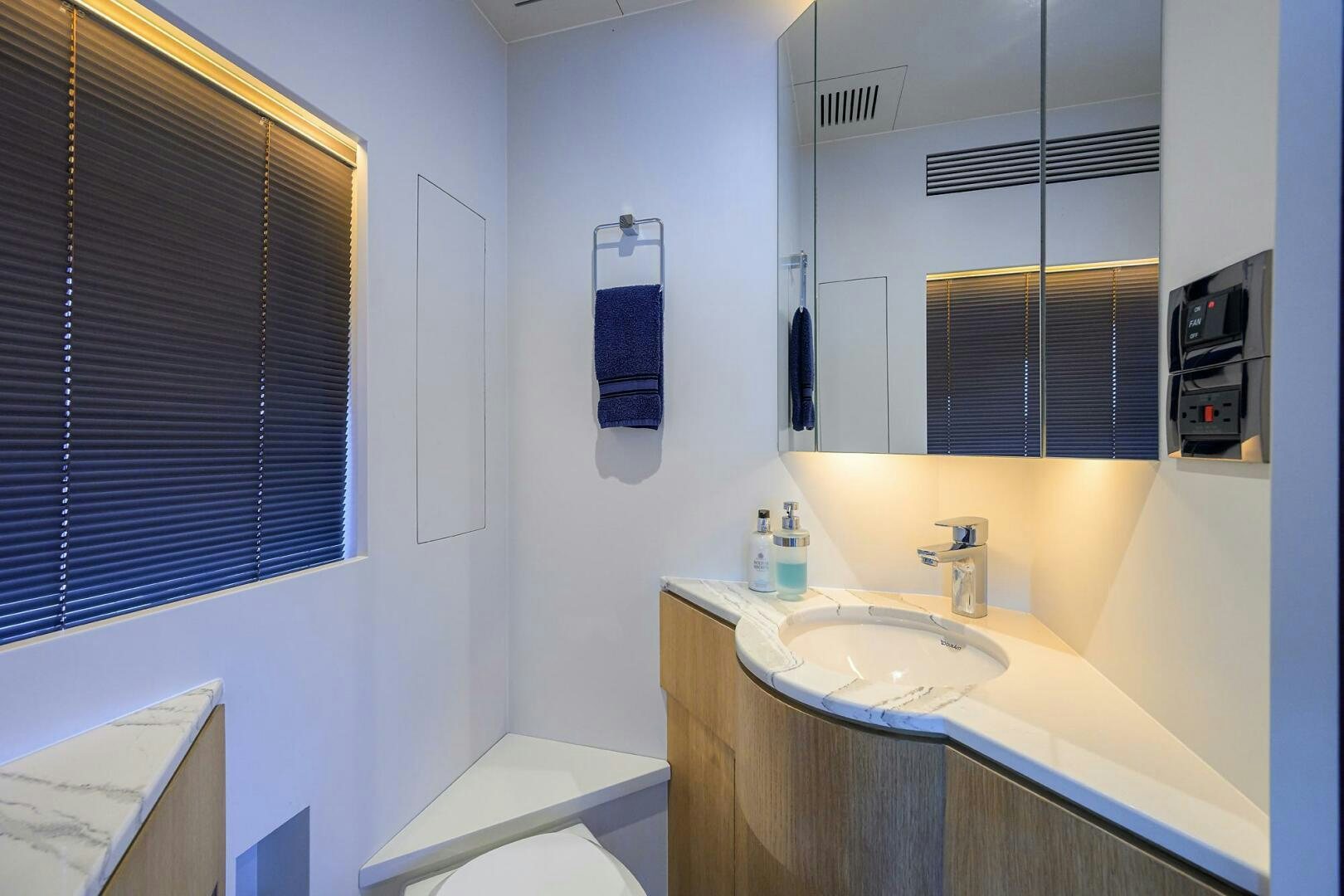 a bathroom with a sink and a mirror aboard AQUA LIFE Yacht for Sale
