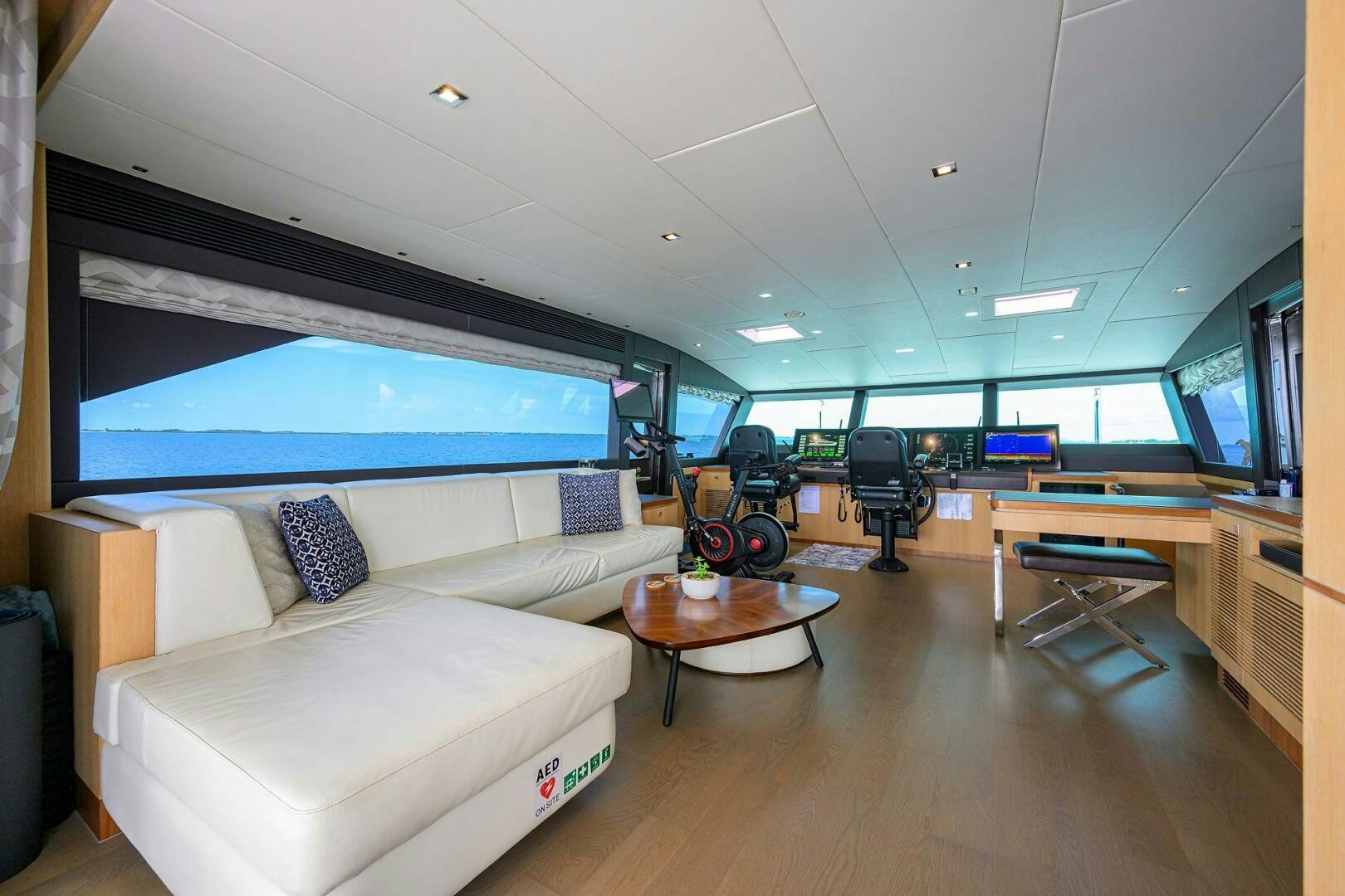 a living room with a couch and a table aboard AQUA LIFE Yacht for Sale