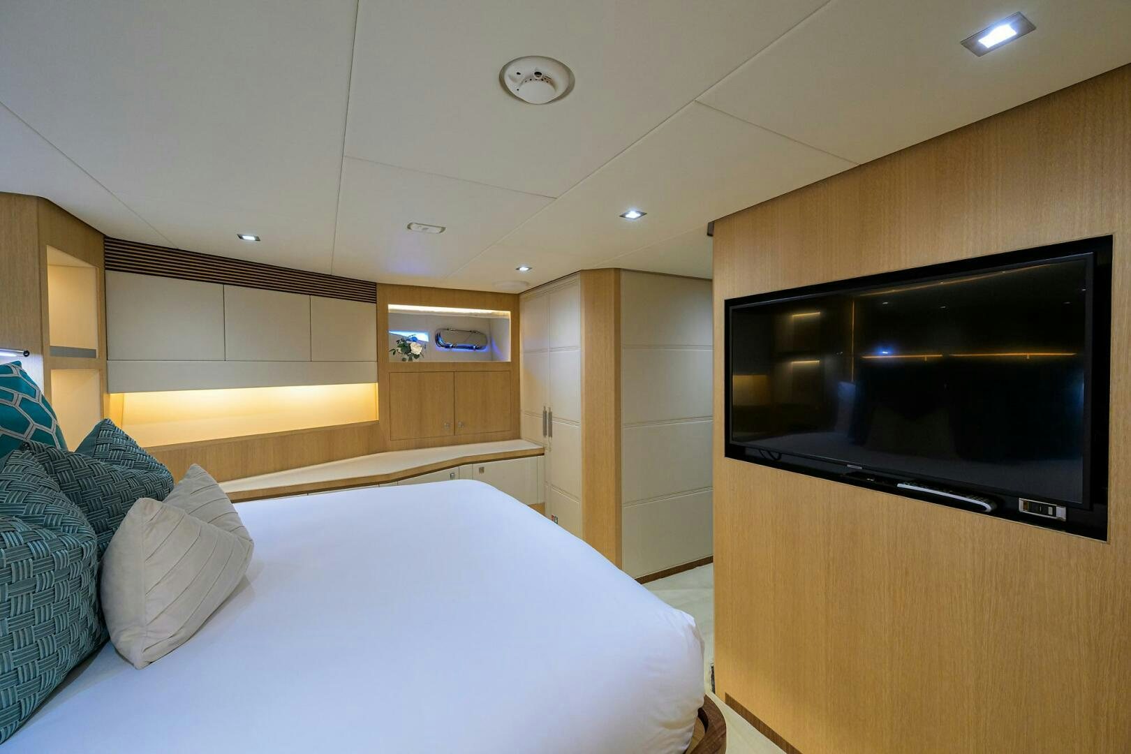a bedroom with a bed and a television aboard AQUA LIFE Yacht for Sale