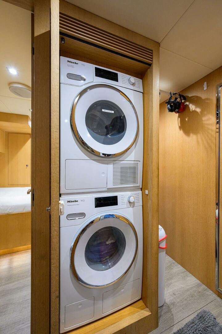 a washing machine in a room aboard AQUA LIFE Yacht for Sale