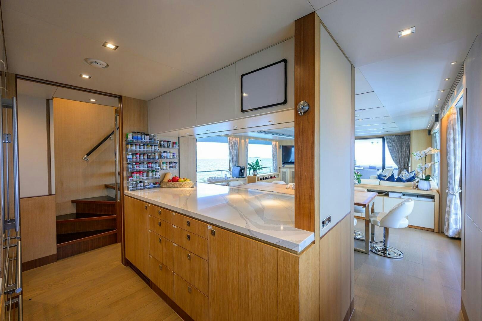 a kitchen with a large window aboard AQUA LIFE Yacht for Sale
