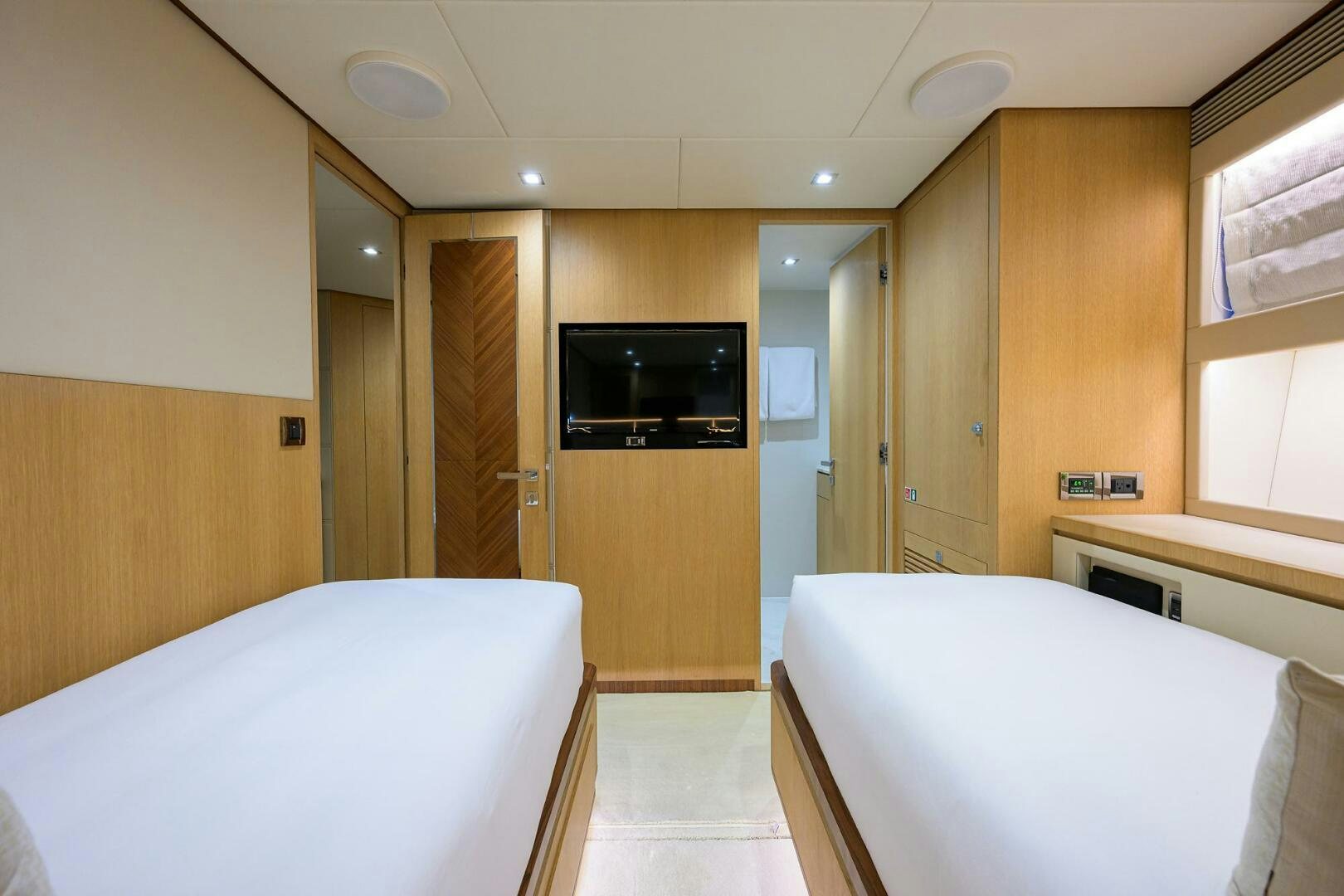 a hotel room with a tv and a bed aboard AQUA LIFE Yacht for Sale