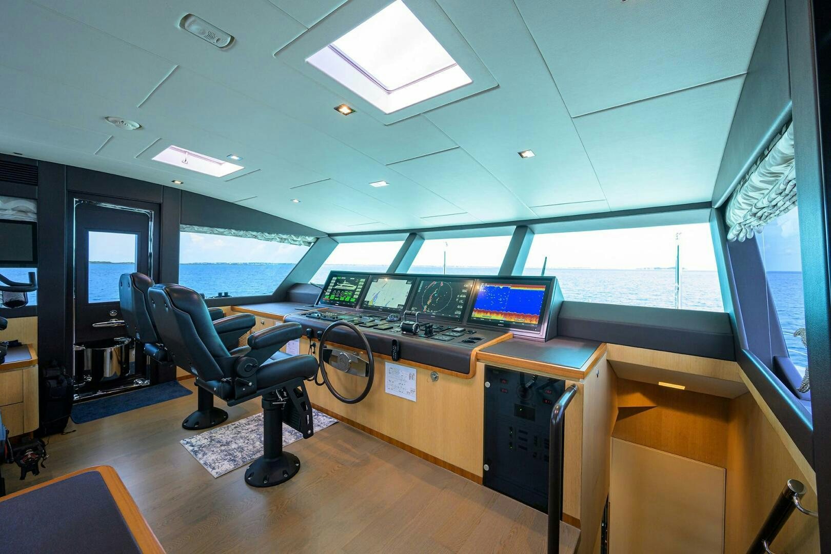 an office with computers and monitors aboard AQUA LIFE Yacht for Sale